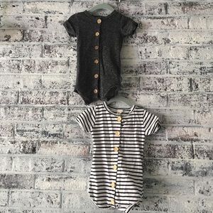 Set of two button front rompers
